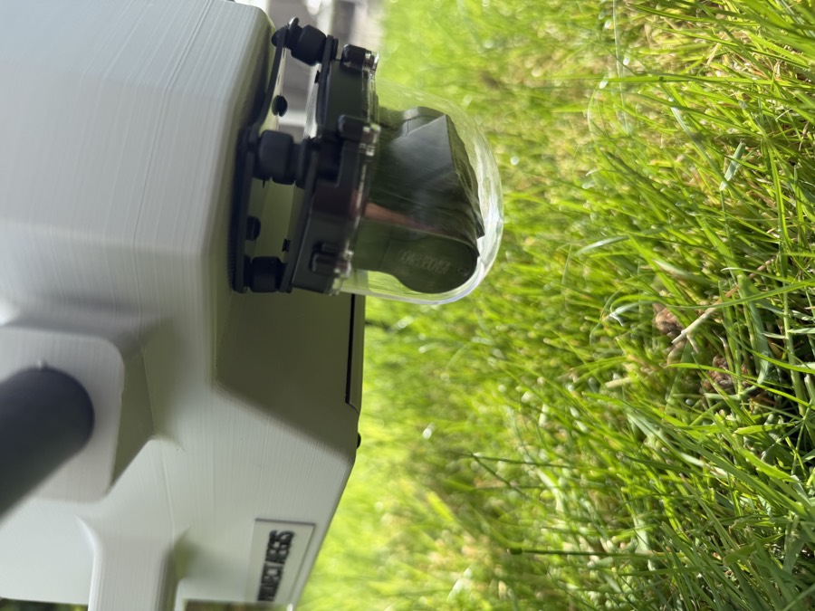 The downward facing camera in a clear dome on the underside of the Aegis fuselage