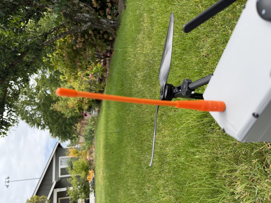 The orange UHF whip antenna mounted on the Aegis fuselage